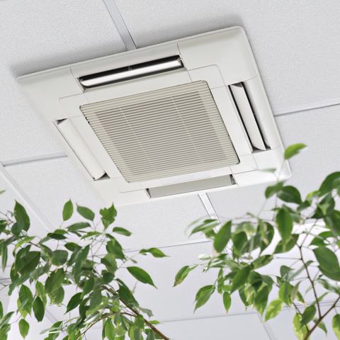 A ceiling cassette air conditioning unit set into a suspended commercial ceiling